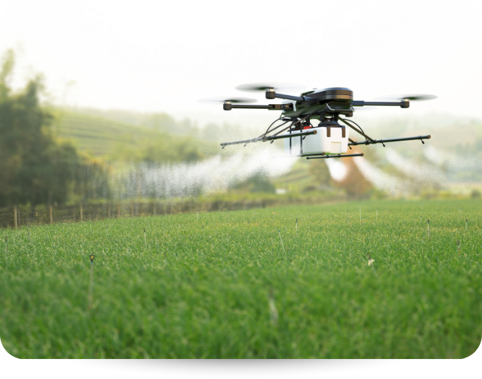 Drone spraying a field